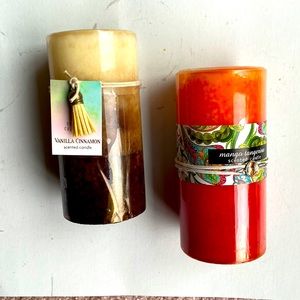 Set of 2 new colored and scented pillar candles.